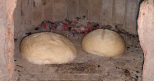 bread, baking in the wood fired beehive oven