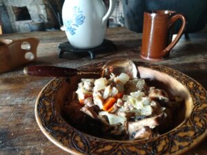 an 18th century meal in a wooden bowl