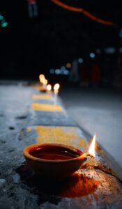 a bowl of liquid sitting on the side of a road