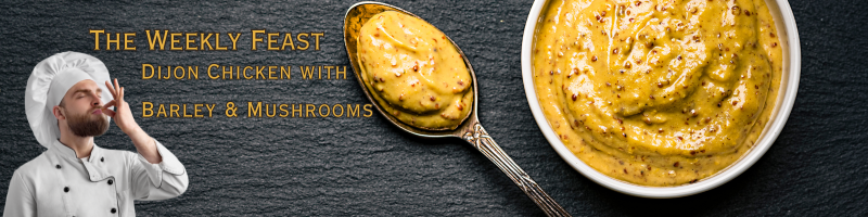 dijon mustard in a bowl and on a spoon