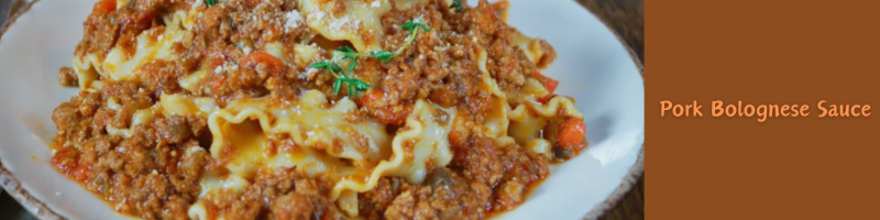 pork bolognese over pasta