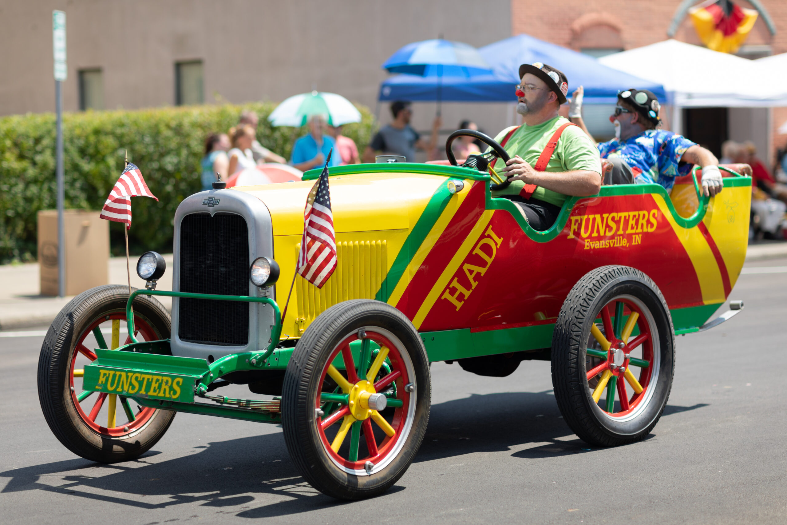 Jasper, Indiana, USA - August 5, 2018: The Strassenfest Parade, Clowns, members of Funsters, driving a clown car down the street during the parade