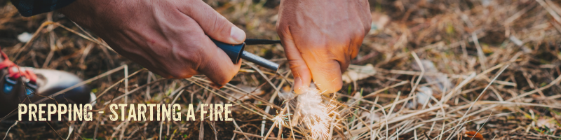 a person using a ferro rod to make a fire