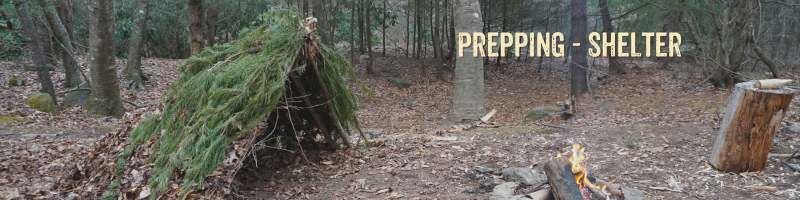 An A-frame shelter open to a fire.