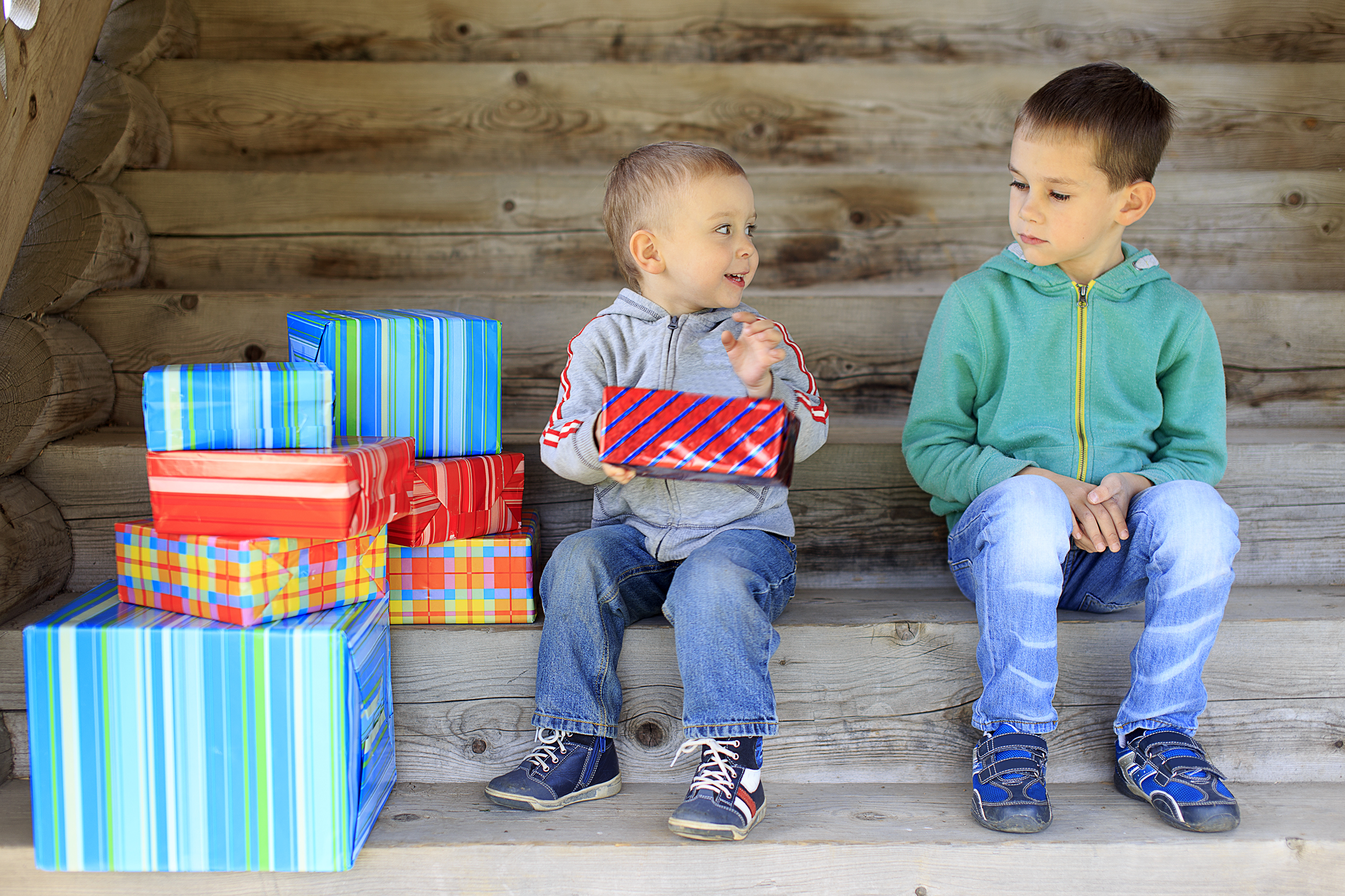 elder brother is jealous of a pile of gifts that are gifted to younger brother