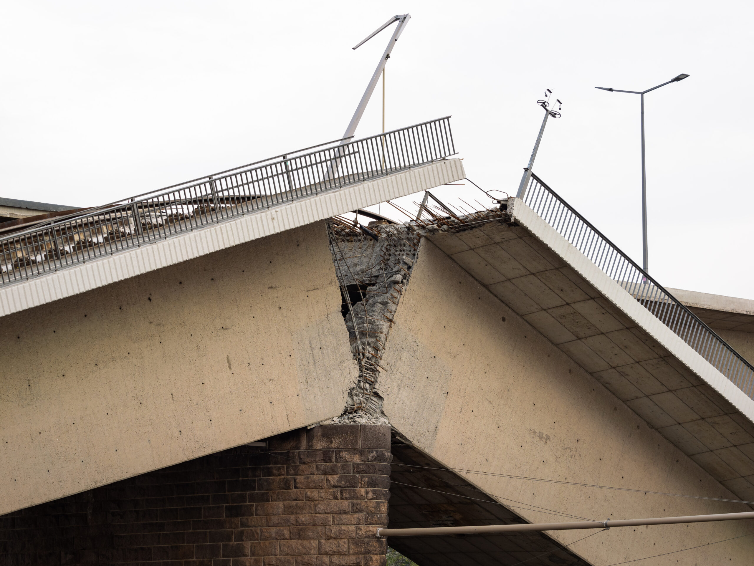 Dresden Carola bridge (Carolabrücke) collapsed. Broken reinforced concrete structure close up. Material damage due to corrosion caused instability. Failed building function.