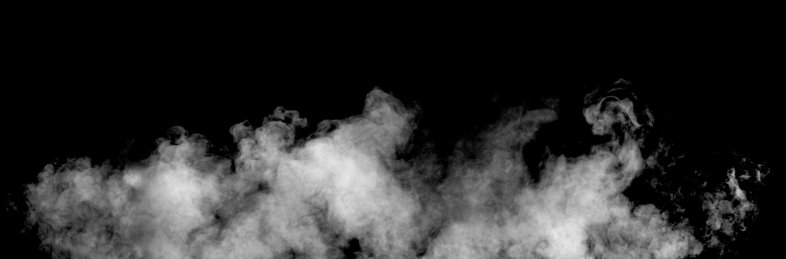 White panoramic white steam or smoke on black background perfect for artistic backgrounds and design elements, enhancing creativity